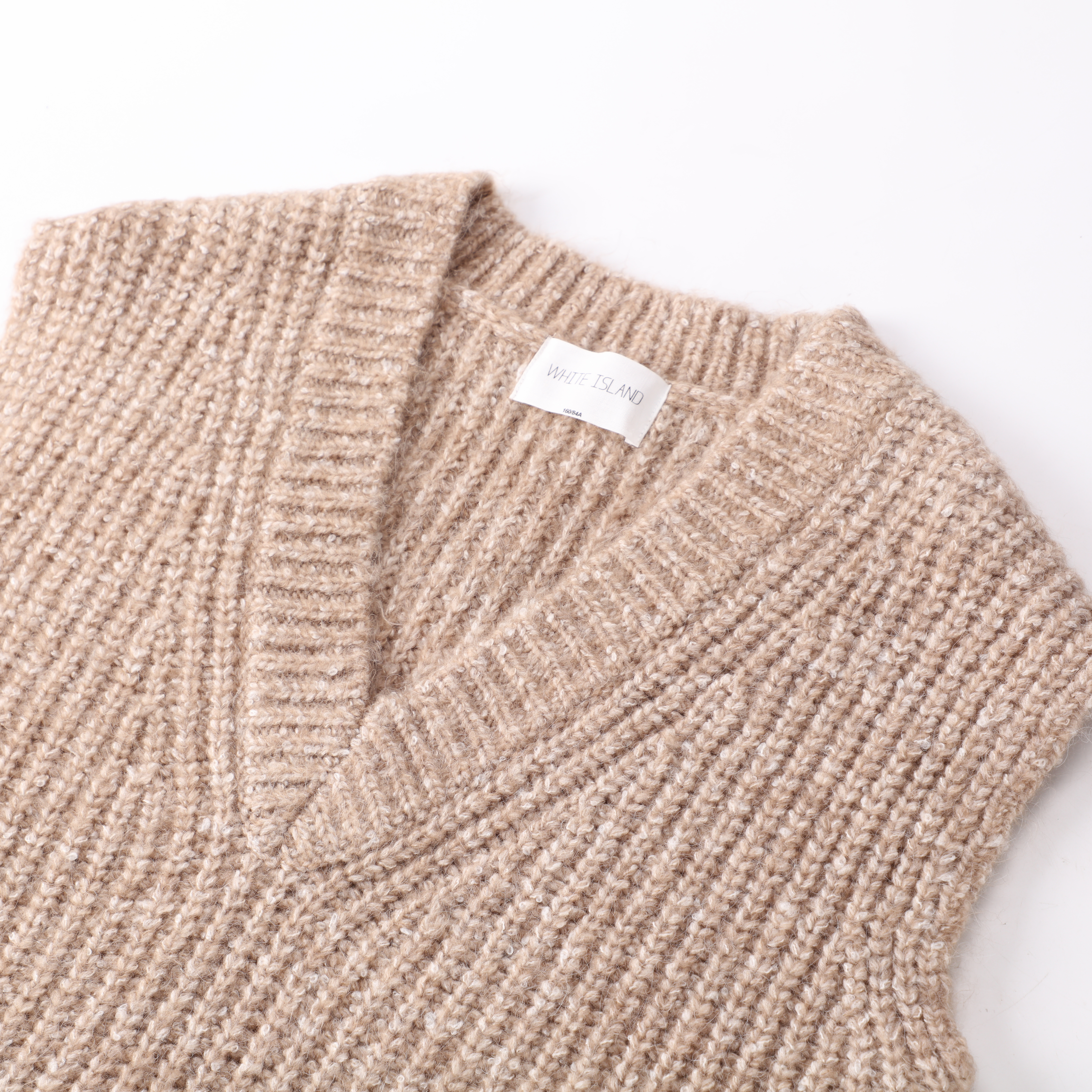 Chaleco sin mangas de la parte superior del suéter del jersey de punto con cuello en V de las mujeres de encargo de la fábrica del OEM 